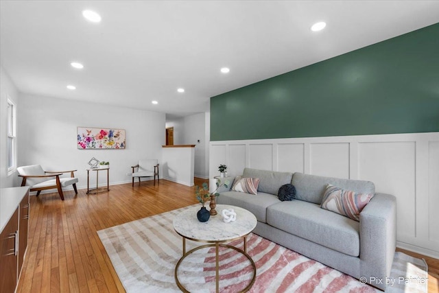 1422 Ridgeway St, Round Lake Beach, IL 60073 - living room with wainscoting, a decorative wall, recessed lighting, and light wood-style floors