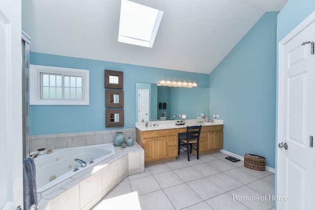 459 Waubonsee Cir, Oswego, IL 60543 - bathroom with double vanity, vaulted ceiling, a jetted tub, a skylight, and tile patterned flooring