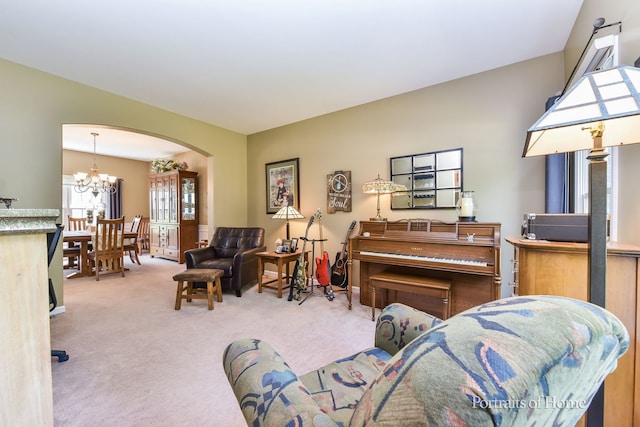 459 Waubonsee Cir, Oswego, IL 60543 - living room with arched walkways, carpet floors, and a chandelier
