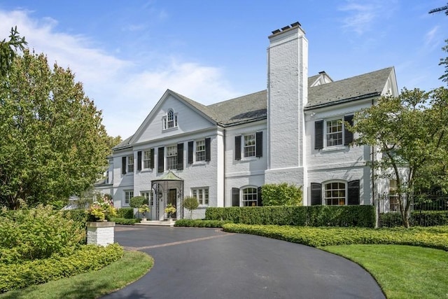 5 Woodley Rd, Winnetka, IL 60093 - view of front of property with a chimney