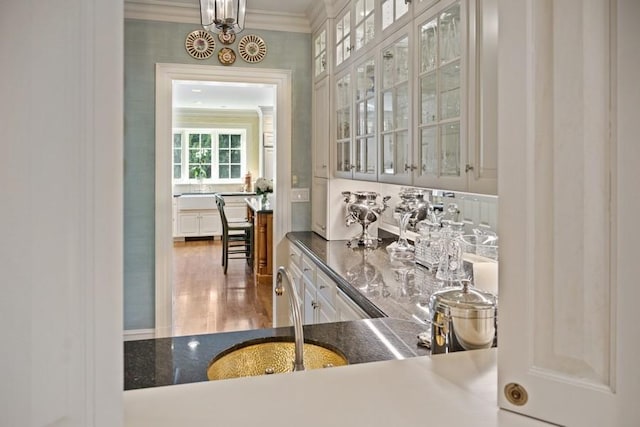 5 Woodley Rd, Winnetka, IL 60093 - indoor bar with ornamental molding, a chandelier, and wood finished floors