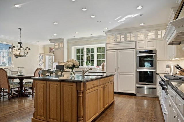 5 Woodley Rd, Winnetka, IL 60093 - kitchen with stainless steel appliances, dark countertops, a warming drawer, ornamental molding, and a chandelier