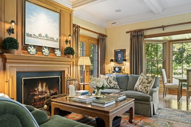 5 Woodley Rd, Winnetka, IL 60093 - living room with healthy amount of natural light, wood finished floors, a warm lit fireplace, ornamental molding, and beamed ceiling