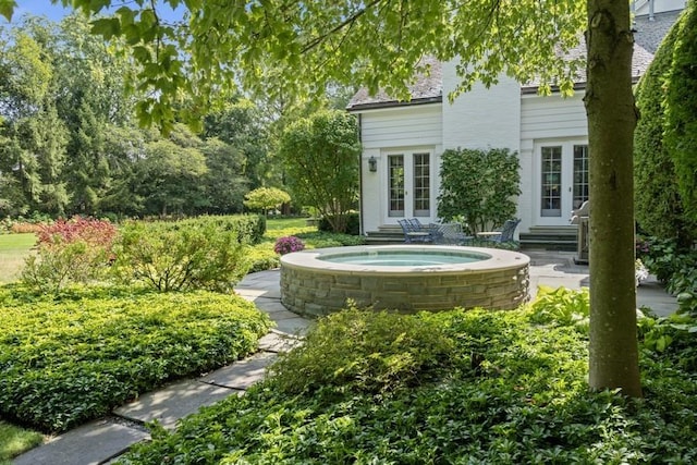 5 Woodley Rd, Winnetka, IL 60093 - view of yard featuring french doors, entry steps, and an outdoor hot tub