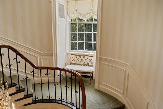 5 Woodley Rd, Winnetka, IL 60093 - stairs featuring wainscoting, carpet flooring, a decorative wall, and wallpapered walls