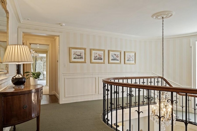 5 Woodley Rd, Winnetka, IL 60093 - hall with ornamental molding, a wainscoted wall, an upstairs landing, a decorative wall, and wallpapered walls