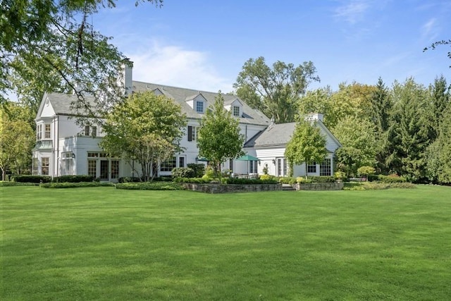 5 Woodley Rd, Winnetka, IL 60093 - back of house featuring a yard and a chimney
