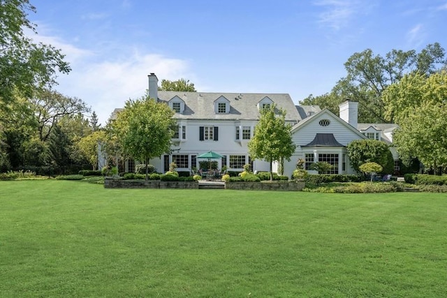 5 Woodley Rd, Winnetka, IL 60093 - back of house featuring a lawn and a chimney