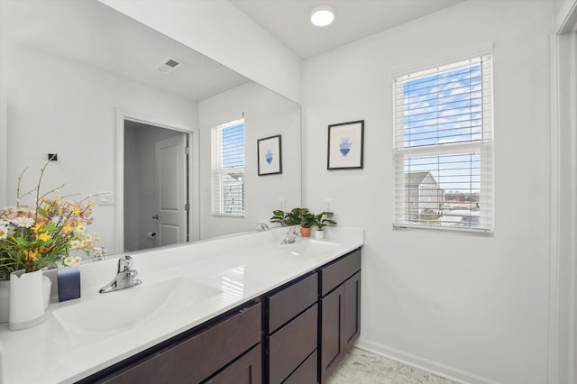 2029 Magnolia Ln, Wonder Lake, IL 60097 - bathroom with double vanity and baseboards