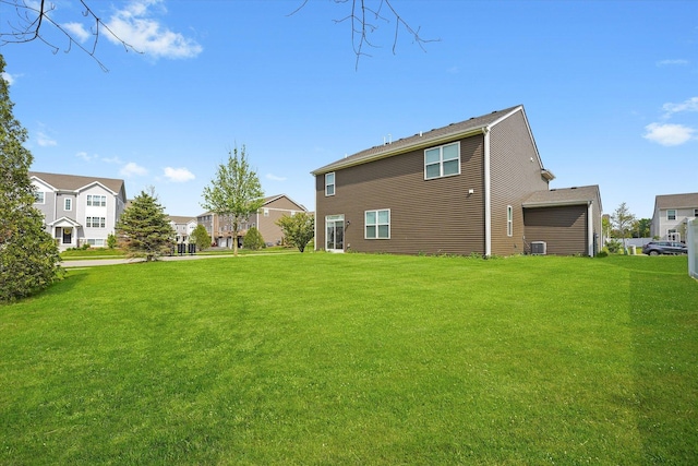 2029 Magnolia Ln, Wonder Lake, IL 60097 - back of property featuring a lawn and a residential view