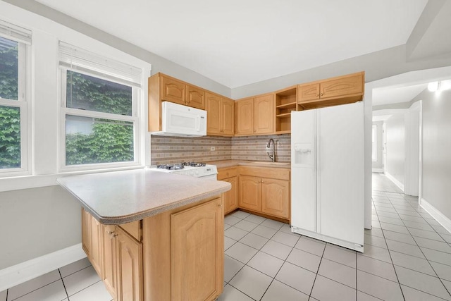 4637 S Homan Ave, Chicago, IL 60632 - kitchen featuring white appliances, light tile patterned floors, a peninsula, light brown cabinets, and light countertops