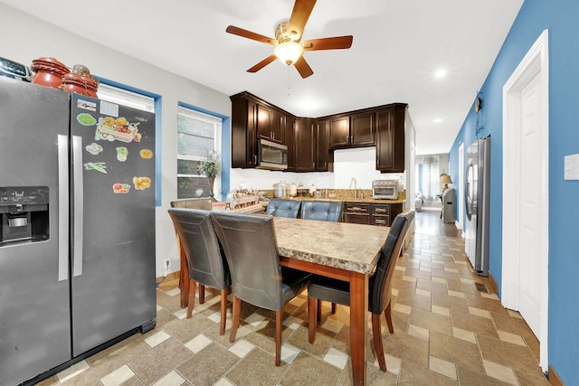 4637 S Homan Ave, Chicago, IL 60632 - kitchen with appliances with stainless steel finishes, dark brown cabinets, a ceiling fan, light countertops, and recessed lighting