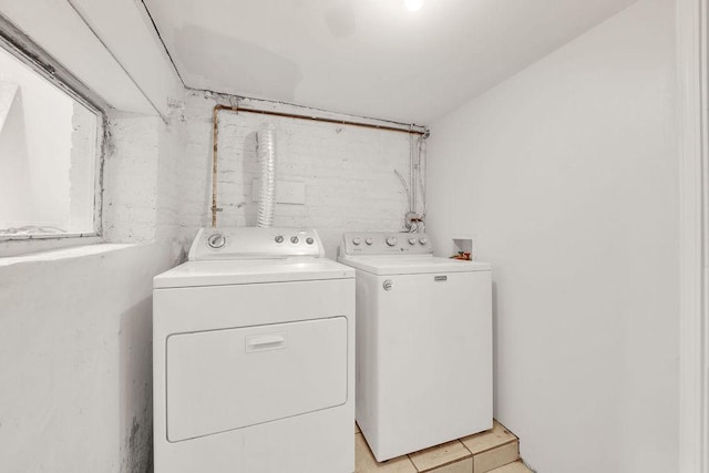 4637 S Homan Ave, Chicago, IL 60632 - laundry area featuring washer and clothes dryer and light tile patterned floors