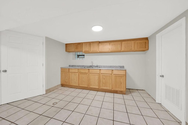 4637 S Homan Ave, Chicago, IL 60632 - kitchen with light countertops and light tile patterned floors