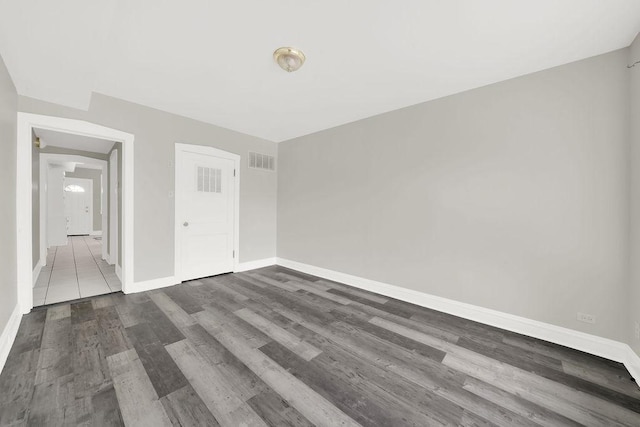 4637 S Homan Ave, Chicago, IL 60632 - unfurnished bedroom with baseboards and dark wood-type flooring