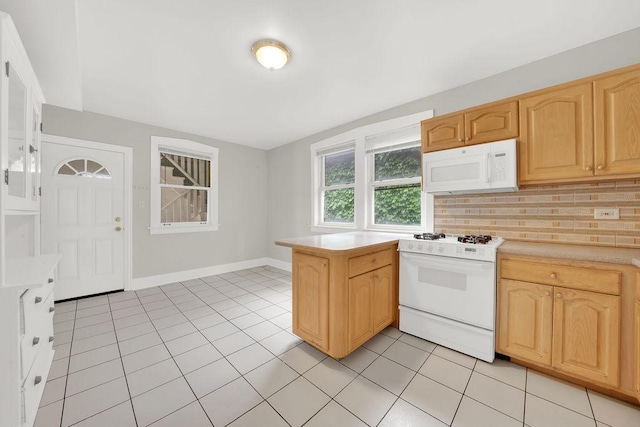 4637 S Homan Ave, Chicago, IL 60632 - kitchen with white appliances, light countertops, backsplash, light tile patterned flooring, and a peninsula