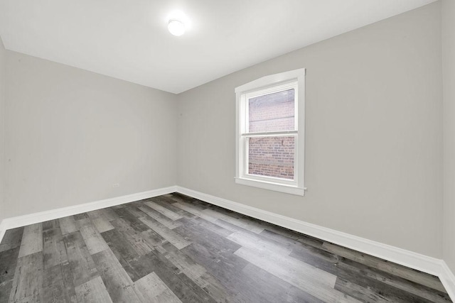 4637 S Homan Ave, Chicago, IL 60632 - spare room with dark wood-style flooring and baseboards