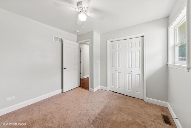 2811 Elim Ave, Zion, IL 60099 - unfurnished bedroom with carpet flooring, a closet, and a ceiling fan