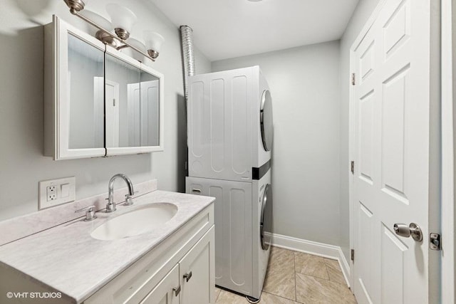 2811 Elim Ave, Zion, IL 60099 - bathroom featuring stacked washing machine and dryer and vanity