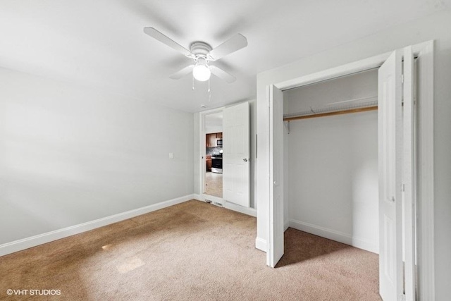 2811 Elim Ave, Zion, IL 60099 - unfurnished bedroom with light carpet, a closet, and a ceiling fan