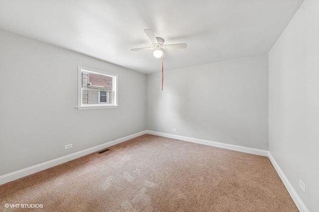 2811 Elim Ave, Zion, IL 60099 - carpeted empty room featuring a ceiling fan and baseboards