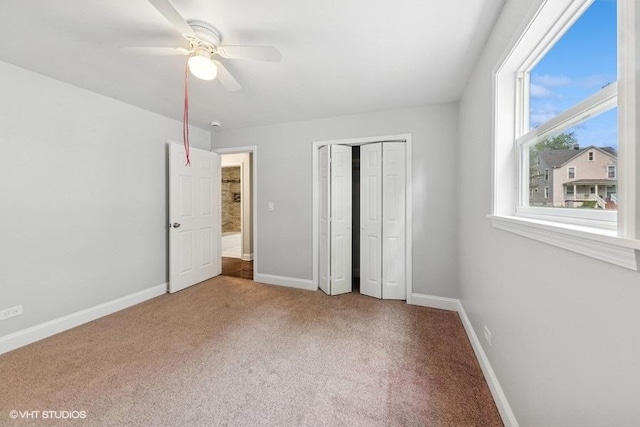 2811 Elim Ave, Zion, IL 60099 - unfurnished bedroom with carpet flooring, a closet, and a ceiling fan