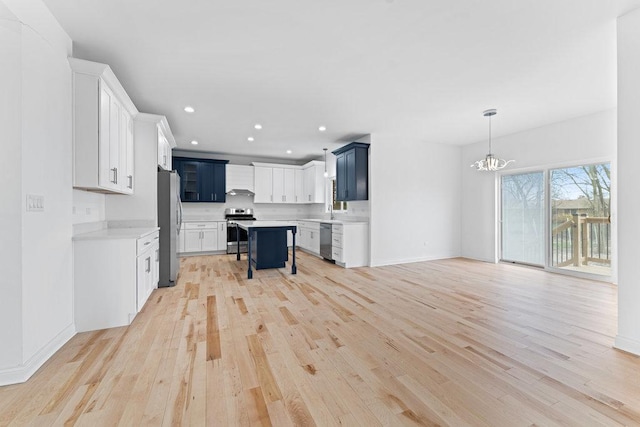 6705 W 91st Pl, Oak Lawn, IL 60453 - kitchen featuring stainless steel appliances, a chandelier, light wood finished floors, light countertops, and recessed lighting