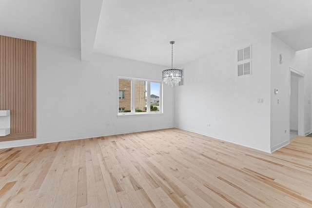 6705 W 91st Pl, Oak Lawn, IL 60453 - unfurnished dining area with light wood-style floors and a chandelier
