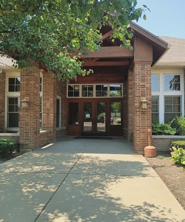 130 Clubhouse Ln Unit 029, Oswego, IL 60543 - view of exterior entry featuring brick siding and french doors