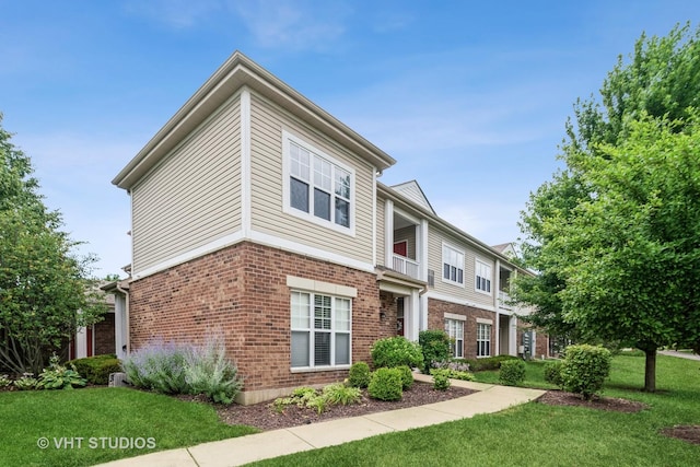 130 Clubhouse Ln Unit 029, Oswego, IL 60543 - view of property featuring a front yard and brick siding