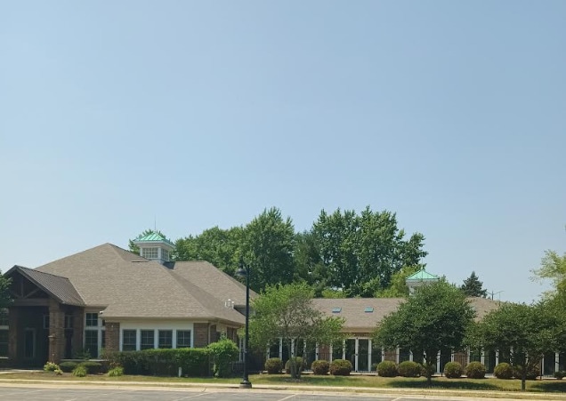 130 Clubhouse Ln Unit 029, Oswego, IL 60543 - view of building exterior with uncovered parking