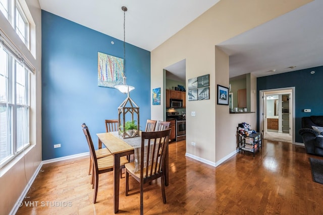 130 Clubhouse Ln Unit 029, Oswego, IL 60543 - dining space with wood finished floors and plenty of natural light