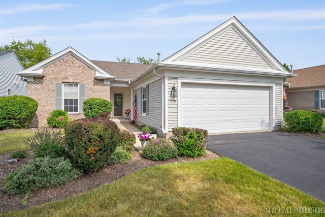 11298 Maplewood Ave, Huntley, IL 60142 - ranch-style home with asphalt driveway, brick siding, and an attached garage