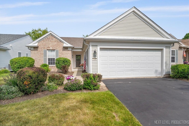 11298 Maplewood Ave, Huntley, IL 60142 - ranch-style home with driveway, an attached garage, brick siding, and a front yard