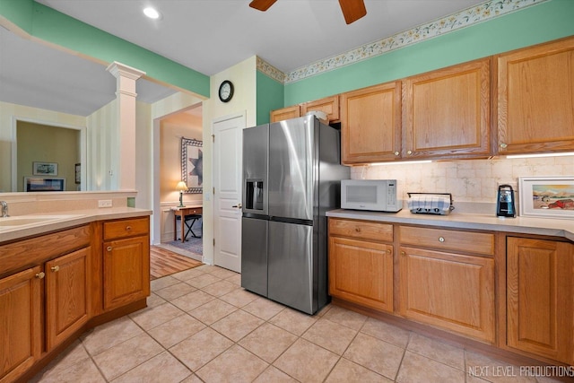 11298 Maplewood Ave, Huntley, IL 60142 - kitchen featuring stainless steel refrigerator with ice dispenser, white microwave, light countertops, and light tile patterned floors