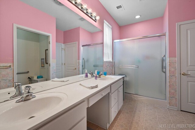 11298 Maplewood Ave, Huntley, IL 60142 - bathroom with double vanity, a shower stall, and tile patterned floors