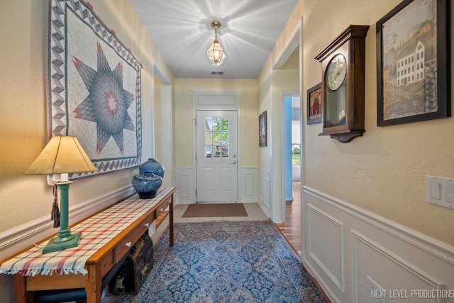 11298 Maplewood Ave, Huntley, IL 60142 - entryway with a wainscoted wall and a decorative wall