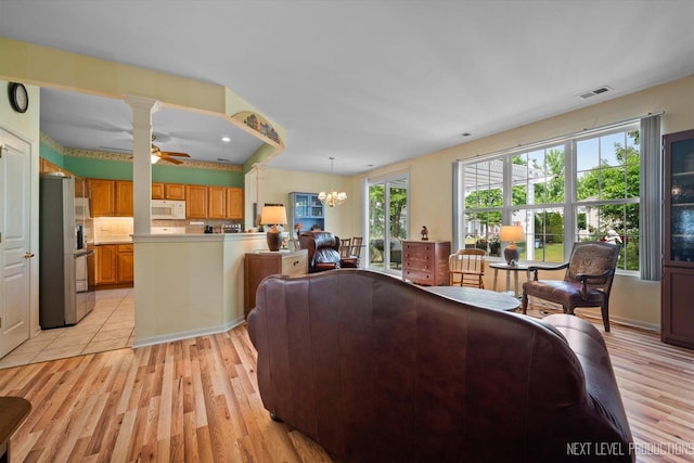 11298 Maplewood Ave, Huntley, IL 60142 - living room featuring a chandelier, light wood-type flooring, and a ceiling fan