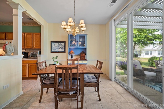 11298 Maplewood Ave, Huntley, IL 60142 - dining room with healthy amount of natural light, a chandelier, and light tile patterned flooring