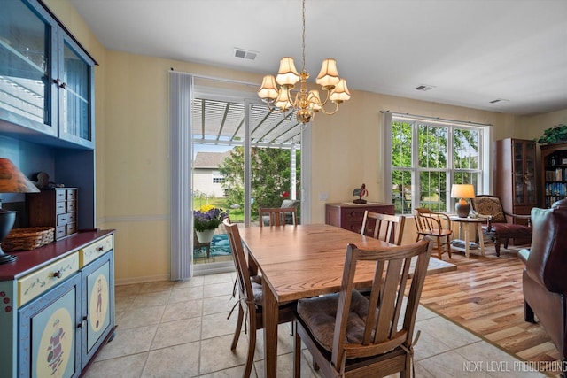 11298 Maplewood Ave, Huntley, IL 60142 - dining area with a chandelier and baseboards