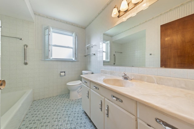821 W Manor Ct, Glenwood, IL 60425 - bathroom with tile patterned floors, vanity, tile walls, bathtub / shower combination, and wallpapered walls