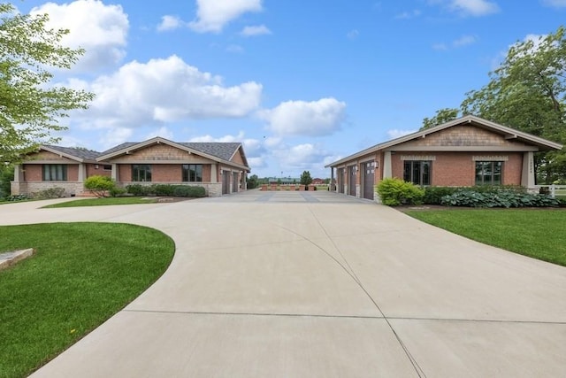 12243 179th St, Mokena, IL 60448 - view of front facade with concrete driveway, a front yard, and brick siding