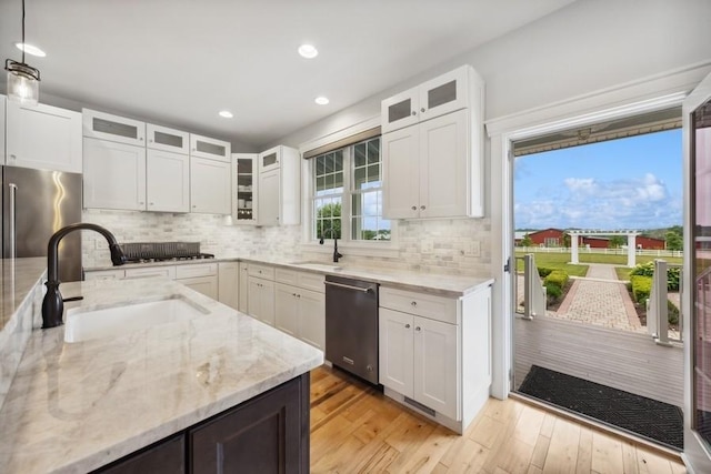 12243 179th St, Mokena, IL 60448 - kitchen featuring stainless steel appliances, light wood-type flooring, recessed lighting, light stone countertops, and backsplash