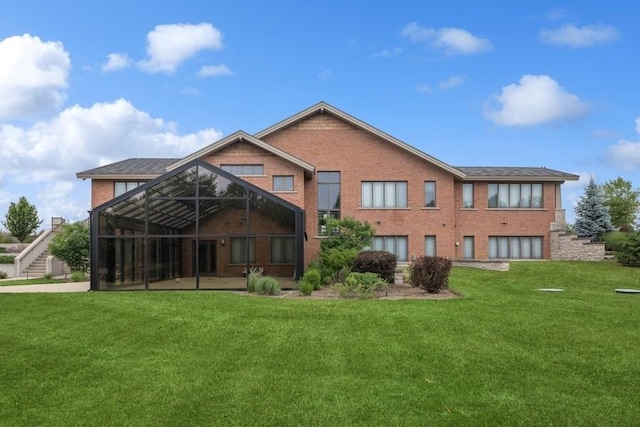 12243 179th St, Mokena, IL 60448 - rear view of property featuring a yard, brick siding, and glass enclosure