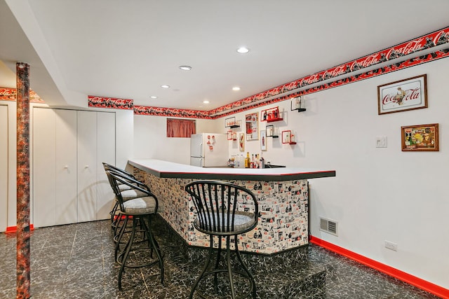 1044 Inverness Ln, Itasca, IL 60143 - indoor dry bar with freestanding refrigerator, granite floors, and recessed lighting
