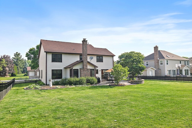 1044 Inverness Ln, Itasca, IL 60143 - back of property with a fenced backyard, a patio area, and a chimney