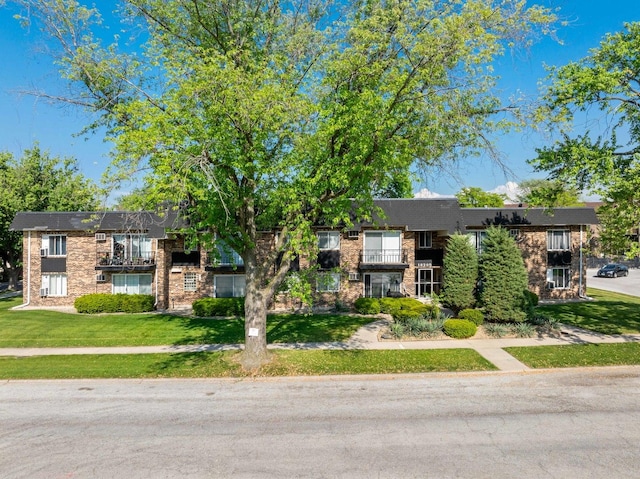 18205 Hart Dr Unit 1A, Homewood, IL 60430 - view of front of house with a front yard and brick siding