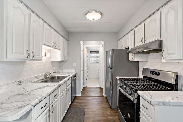 18205 Hart Dr Unit 1A, Homewood, IL 60430 - kitchen featuring appliances with stainless steel finishes, under cabinet range hood, white cabinets, and decorative backsplash