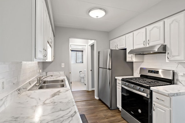 18205 Hart Dr Unit 1A, Homewood, IL 60430 - kitchen featuring stainless steel appliances, under cabinet range hood, white cabinetry, backsplash, and light countertops