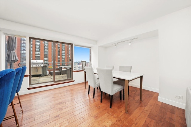 801 S Plymouth Ct Unit 602, Chicago, IL 60605 - dining room with rail lighting and wood-type flooring